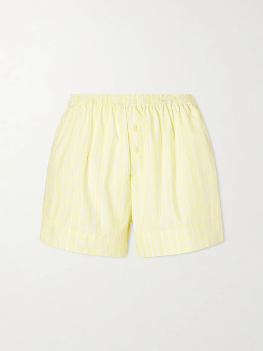 Image of a model wearing Shorts. Product name - Lonia Striped Cotton Shorts in Yellow colour by brand - Faithfull