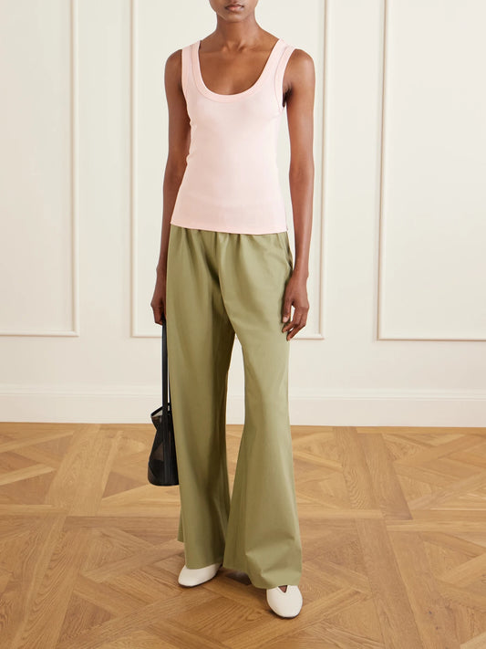 Image of a model wearing Tops. Product name - Hillie Organic Cotton-jersey Tank in Pastel pink colour by brand - FLORE FLORE