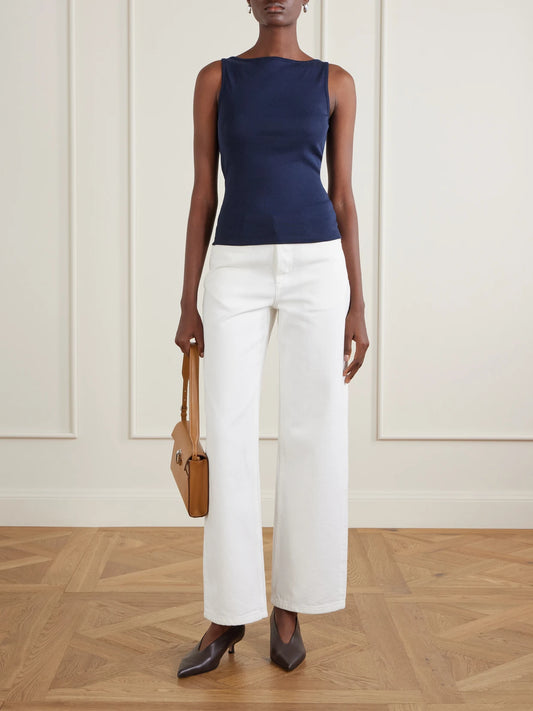 Image of a model wearing Tops. Product name - Timmi Ribbed Organic Cotton Tank in Navy colour by brand - FLORE FLORE