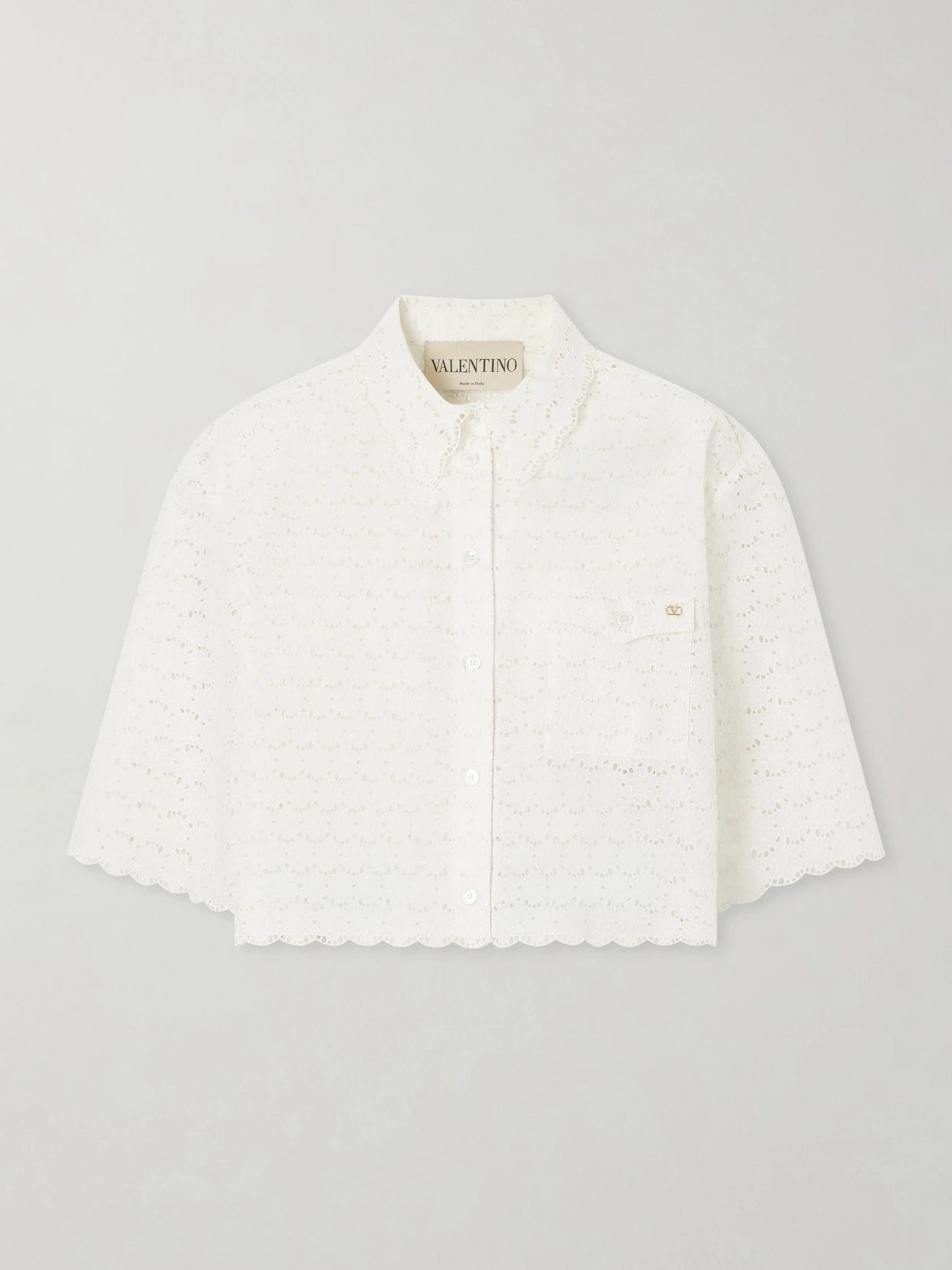 Image of Blouses. Product name - Mossi Logo-embellished Cropped Broderie Anglaise Cotton Blouse in Ivory colour by brand - Valentino Garavani