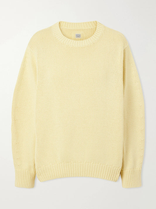 Image of a model wearing Outerwear. Product name - Oversized Organic Cotton-blend Sweater in Pastel yellow colour by brand - TOTEME