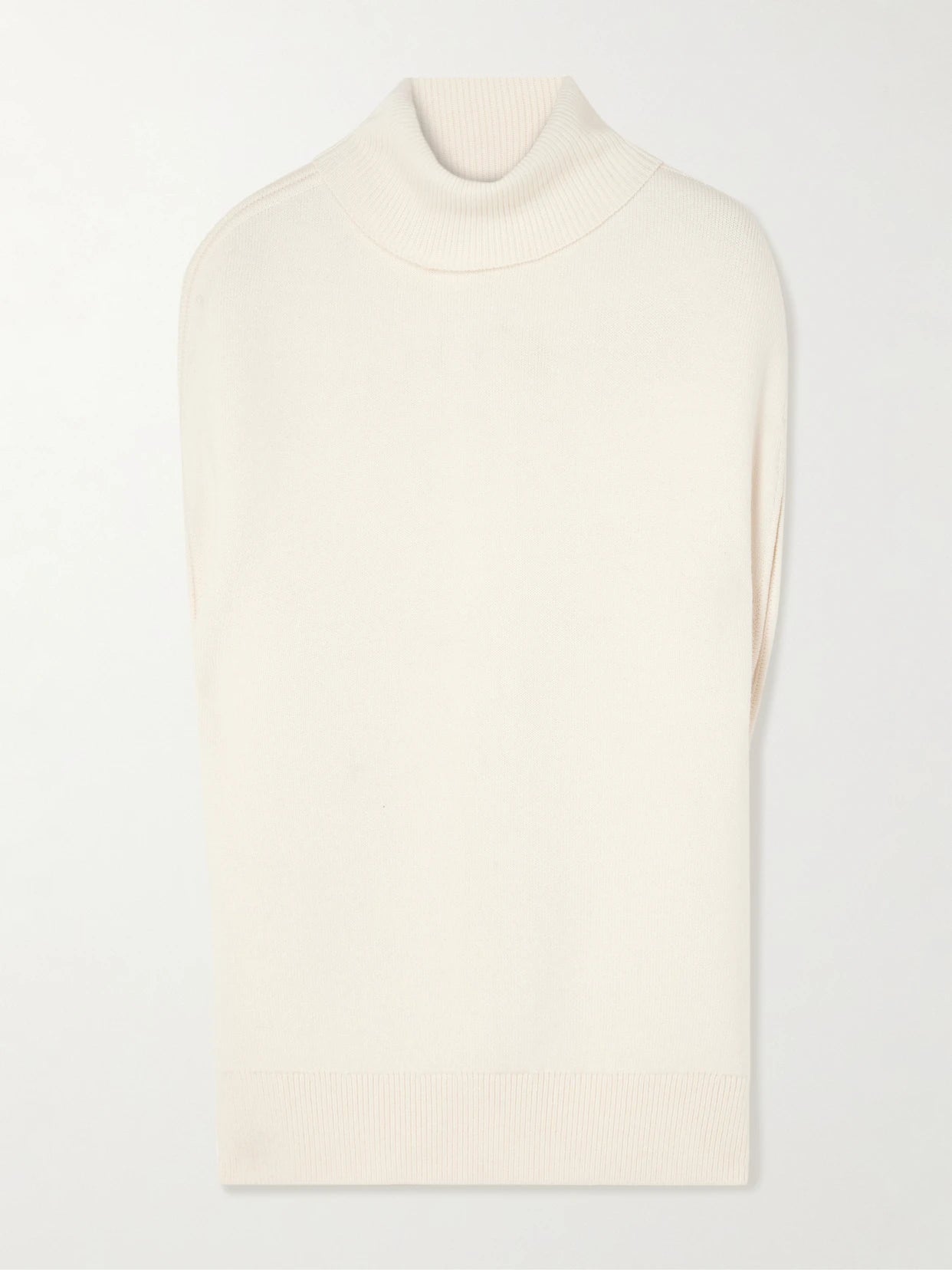 Image of a model wearing Outerwear. Product name - Oversized Knitted Wool Turtleneck Tank in White colour by brand - TOTEME