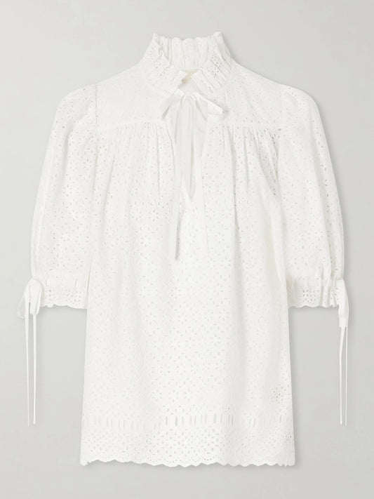 Image of a model wearing Tops. Product name - Alouette Cotton-blend Broderie Anglaise Shirt in White colour by brand - Ulla Johnson