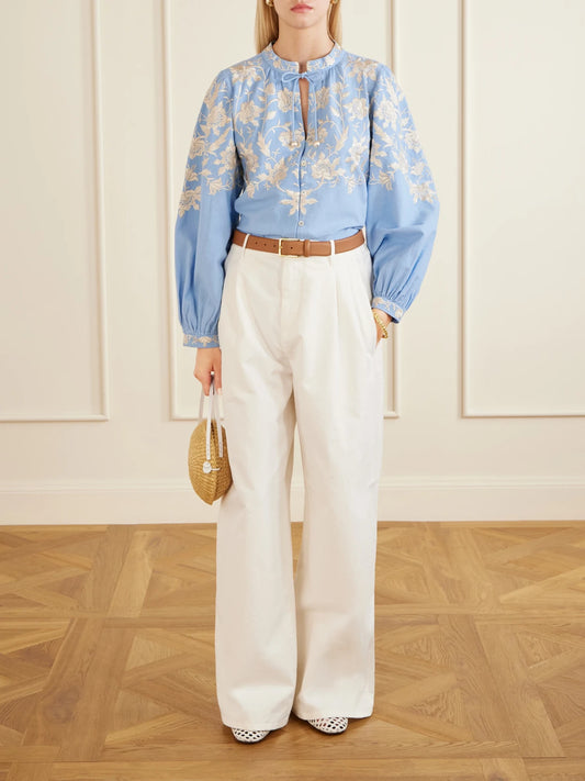 Image of a model wearing Tops. Product name - Alina Embroidered Cotton And Linen-blend Blouse in Blue colour by brand - Sea