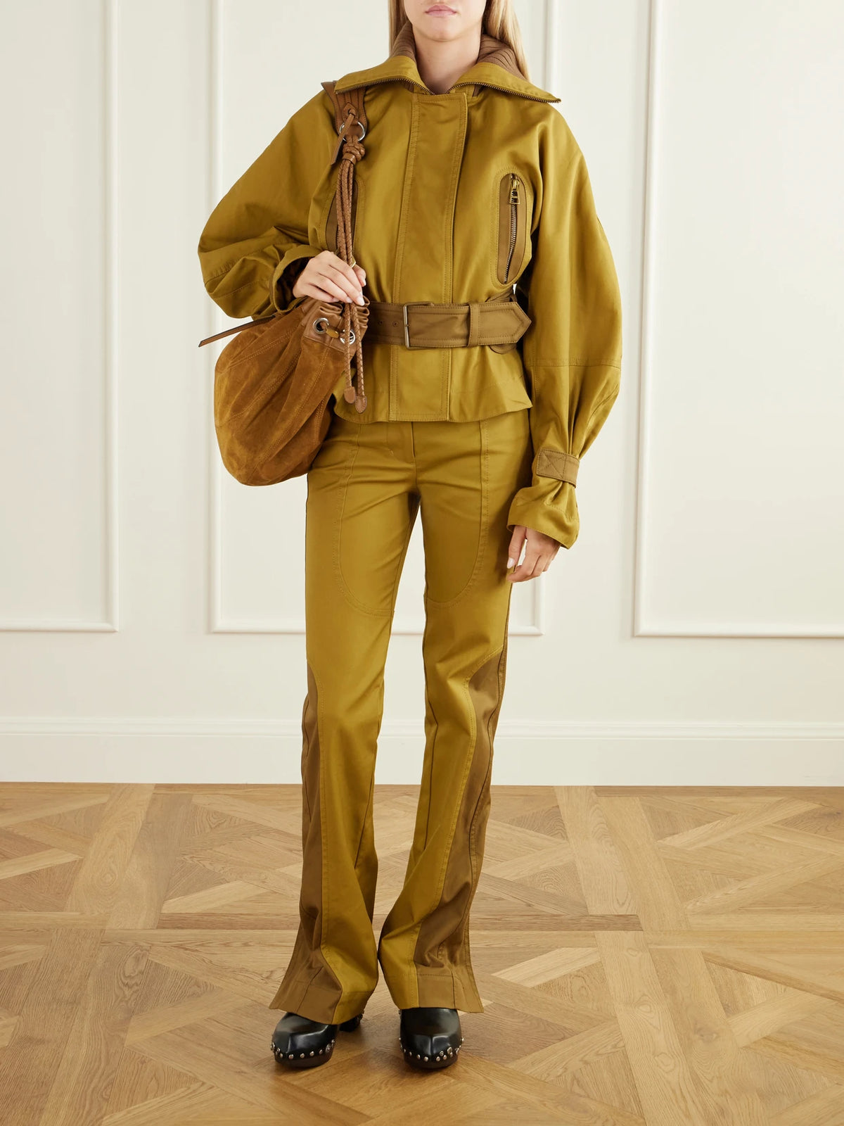 Image of a model wearing Pants. Product name - Valiant Two-tone Paneled Cotton-drill Mid-rise Straight-leg Pants in Brown colour by brand - Zimmermann
