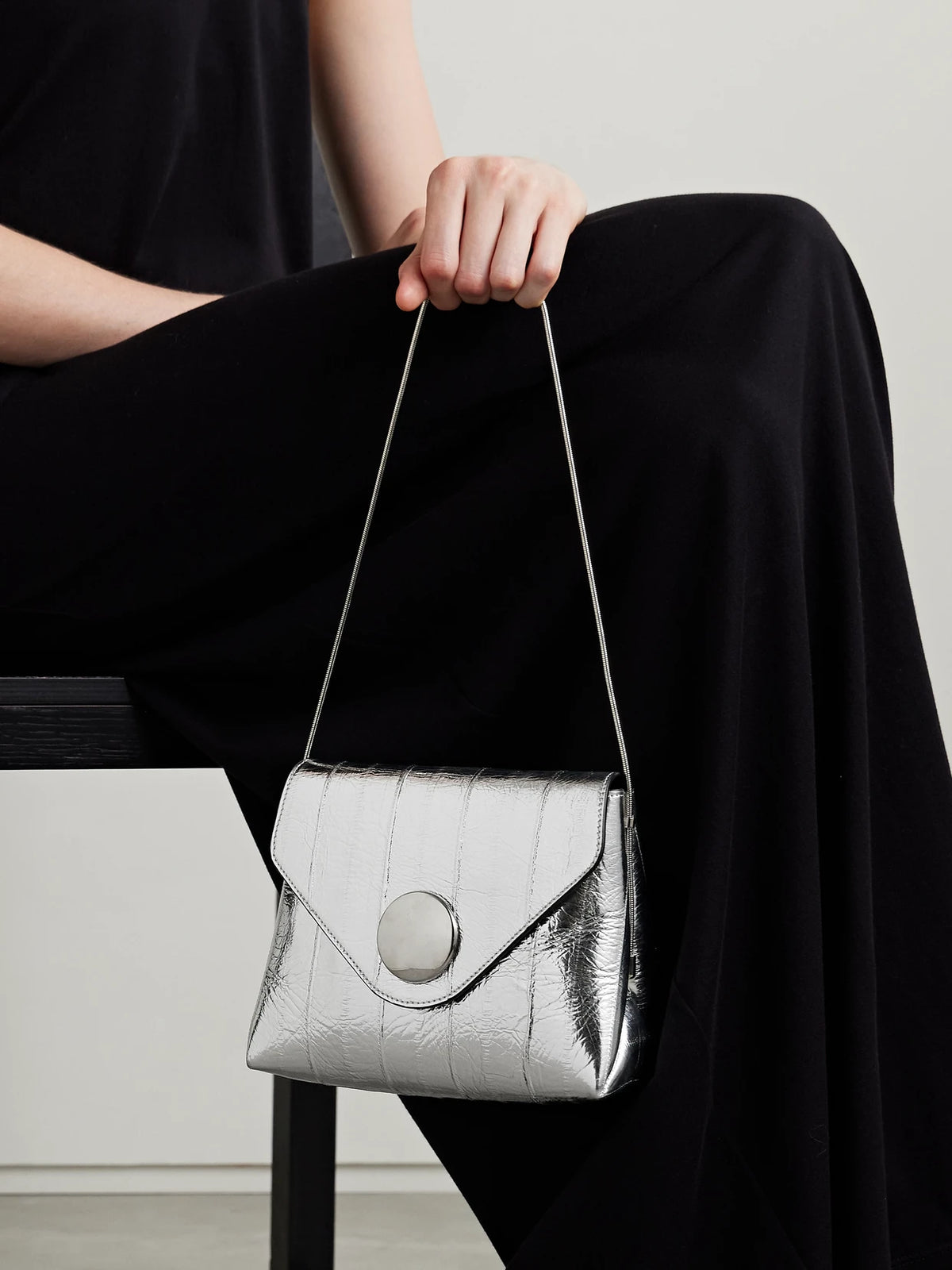 Image of Bags. Product name - Bobbi Metallic Eel Shoulder Bag in Silver colour by brand - KHAITE