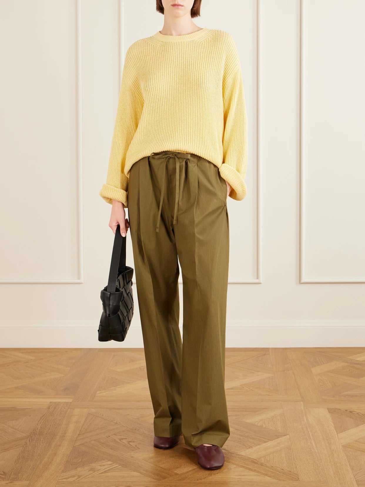 Image of a model wearing Outerwear. Product name - Cotton And Linen-blend Sweater in Yellow colour by brand - Another Tomorrow