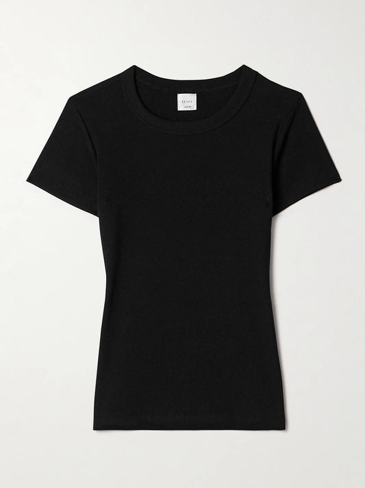 Image of a model wearing Tops. Product name - Kelly Ribbed Cotton-blend Jersey T-shirt in Black colour by brand - LESET