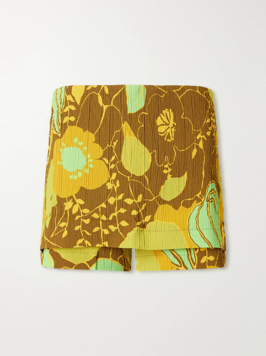 Image of a model wearing Shorts. Product name - Kamara Printed Crepon Skort in Yellow colour by brand - Tibi