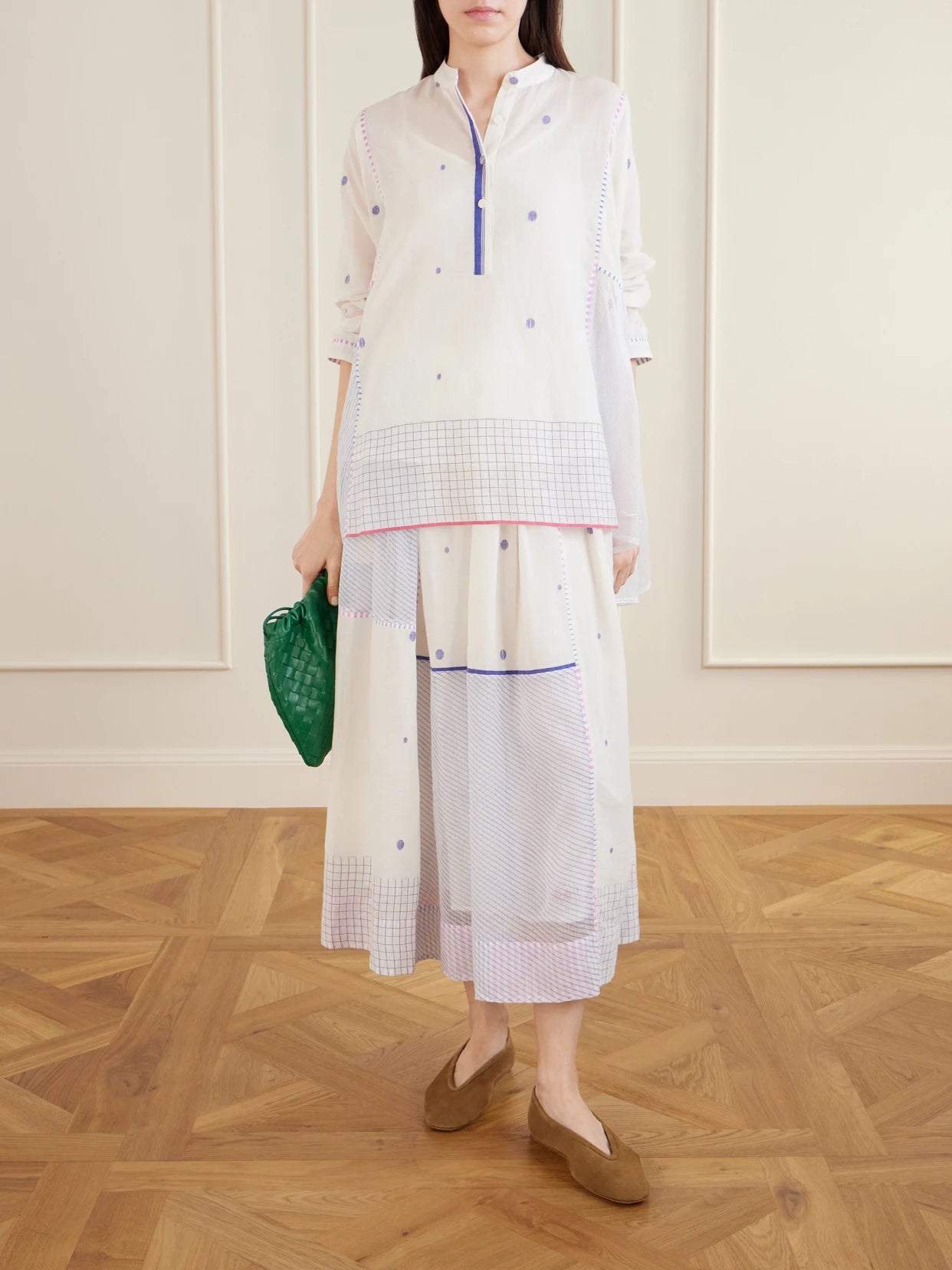 Image of a model wearing Tops. Product name - Cosmos Handwoven Cotton-jamdani Blouse Patched With Printed Stripes in Off-white colour by brand - Eka