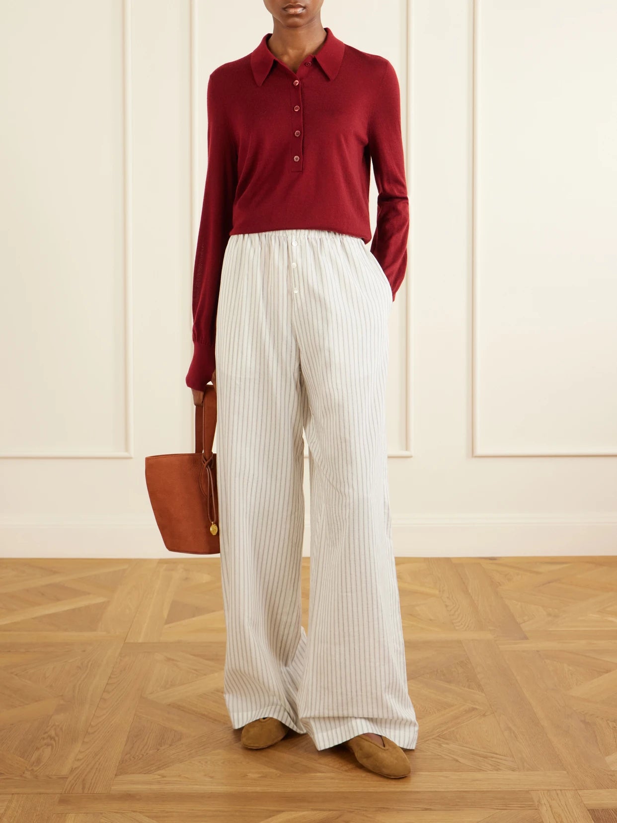 Image of a model wearing Outerwear. Product name - Cashmere Polo Sweater in Burgundy colour by brand - TWP