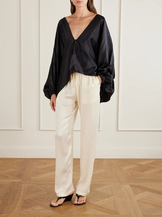 Image of a model wearing Pants. Product name - Tuileries Satin Straight-leg Pants in Ecru colour by brand - Sharon Wauchob