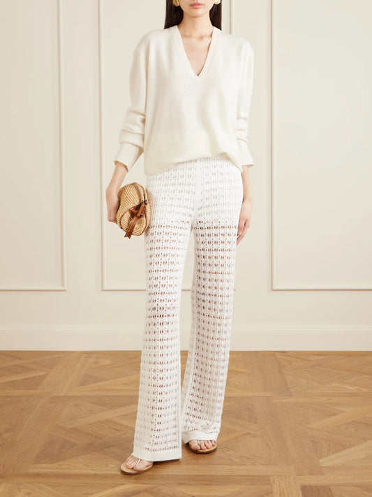Image of a model wearing Pants. Product name - Ray Crocheted Cotton Straight-leg Pants in White colour by brand - Arch4