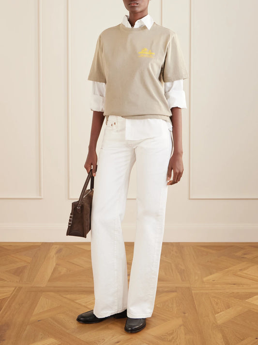Image of a model wearing Tops. Product name - Printed Cotton T-shirt in Beige colour by brand - Aimé Leon Dore