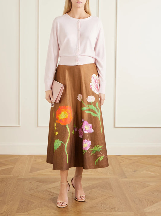 Image of a model wearing Skirts. Product name - Floral-print Cotton-poplin High-waist Midi Skirt in Brown colour by brand - Oscar de la Renta