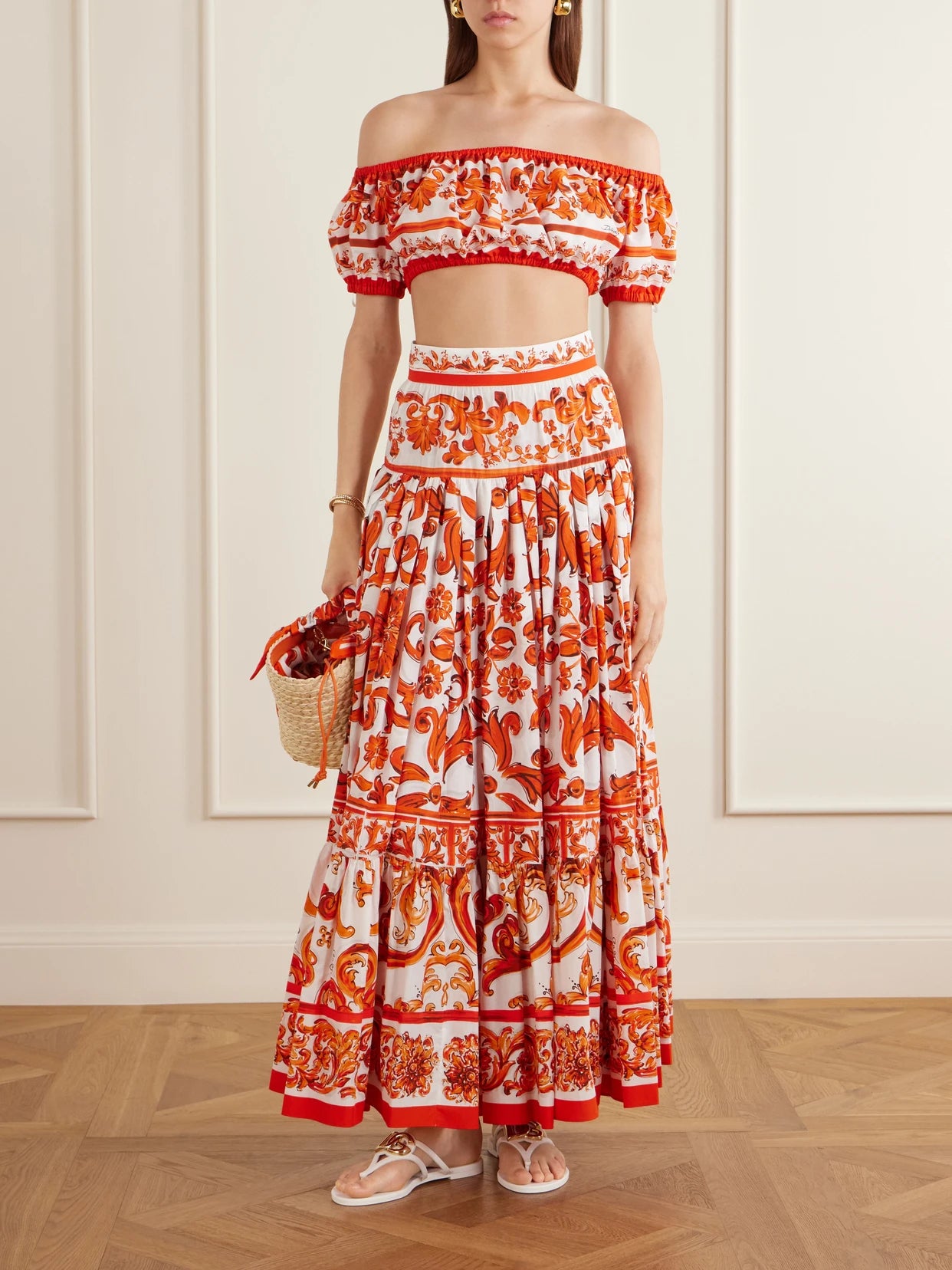 Image of a model wearing Skirts. Product name - Printed Cotton-poplin Maxi Skirt in Orange colour by brand - Dolce & Gabbana