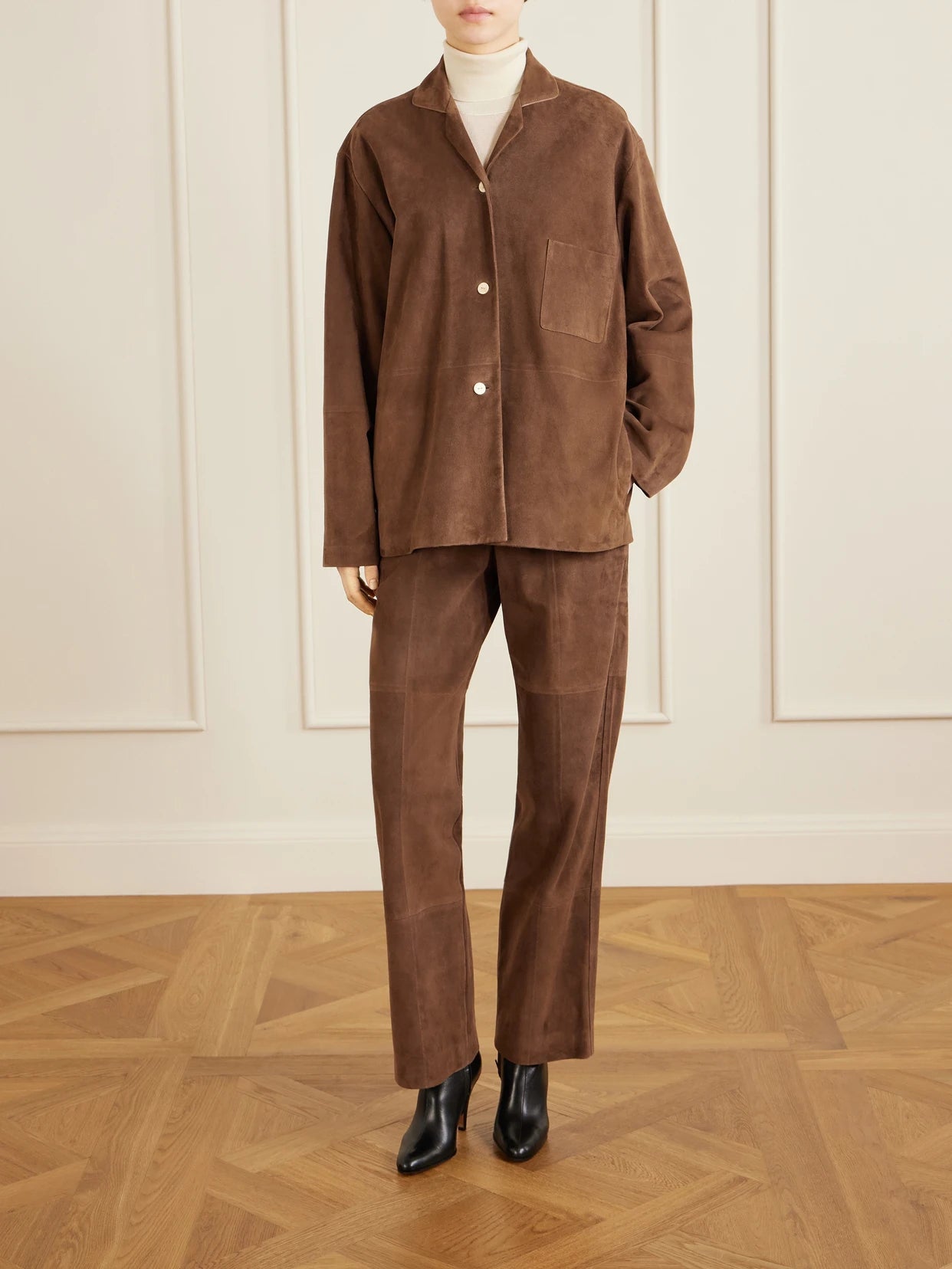 Image of a model wearing Tops. Product name - Janine Suede Shirt in Brown colour by brand - The Row