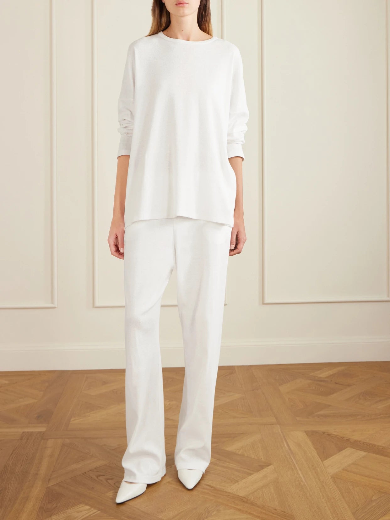 Image of a model wearing Pants. Product name - Kohana Cotton-jersey Wide-leg Pants in White colour by brand - The Row