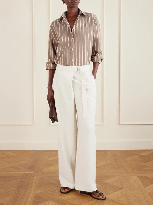 Image of a model wearing Pants. Product name - Belted Pleated Twill Wide-leg Pants in White colour by brand - Brunello Cucinelli