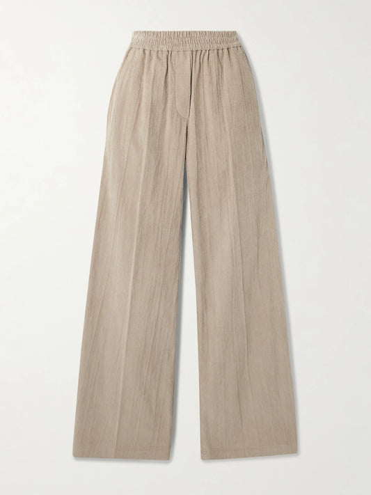 Image of a model wearing Pants. Product name - Gathered Cotton-blend Corduroy Wide-leg Pants in Beige colour by brand - Brunello Cucinelli