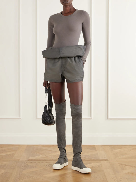 Image of a model wearing Shorts. Product name - Crater Sculptural Washed Satin Shorts in Stone colour by brand - Rick Owens