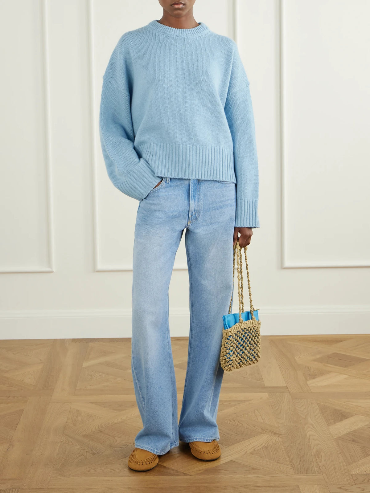 Image of a model wearing Outerwear. Product name - Campa Merino Wool Sweater in Light blue colour by brand - SKALL