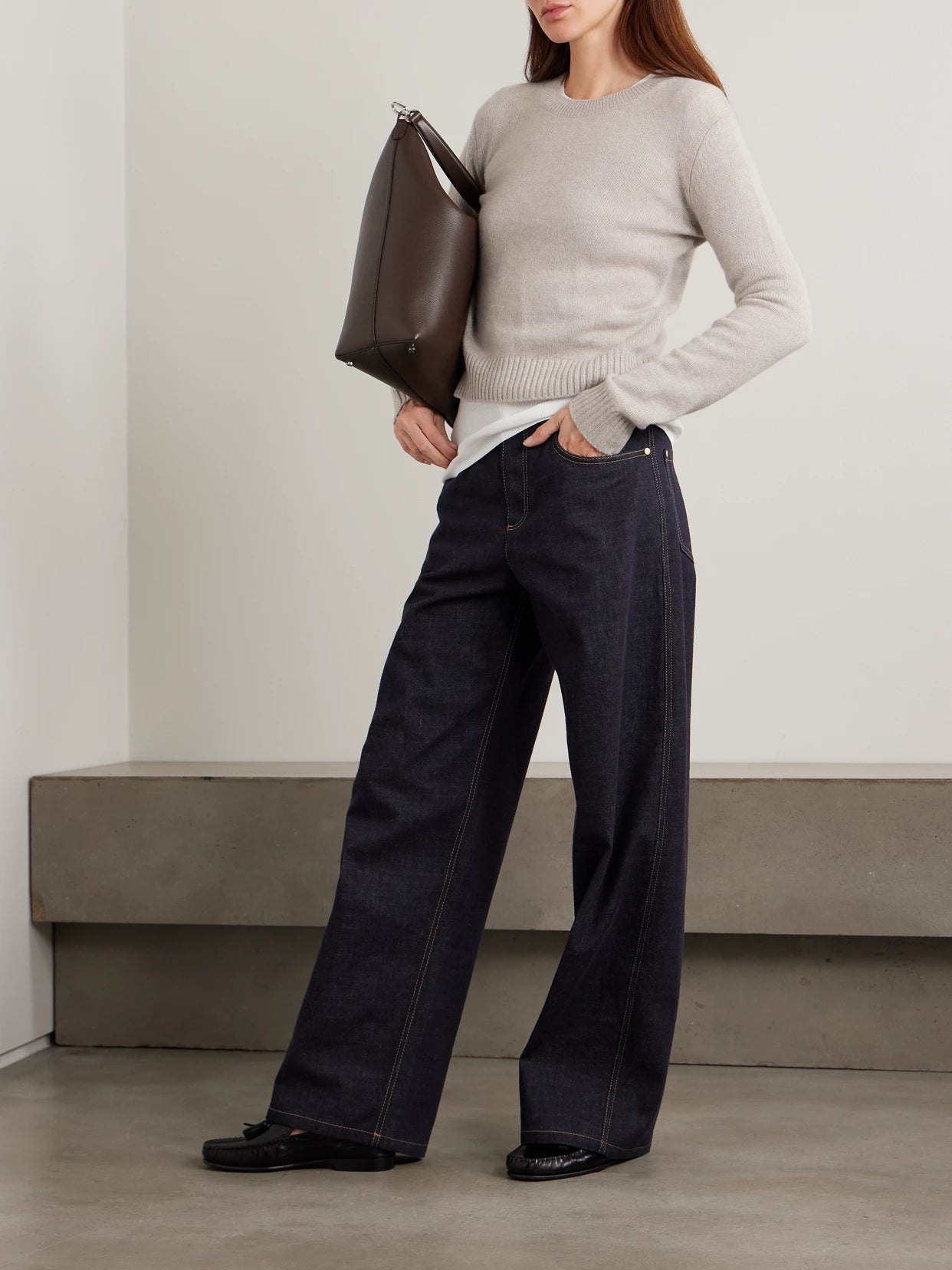 Image of a model wearing Outerwear. Product name - Mable Cashmere Sweater in Sand colour by brand - LISA YANG