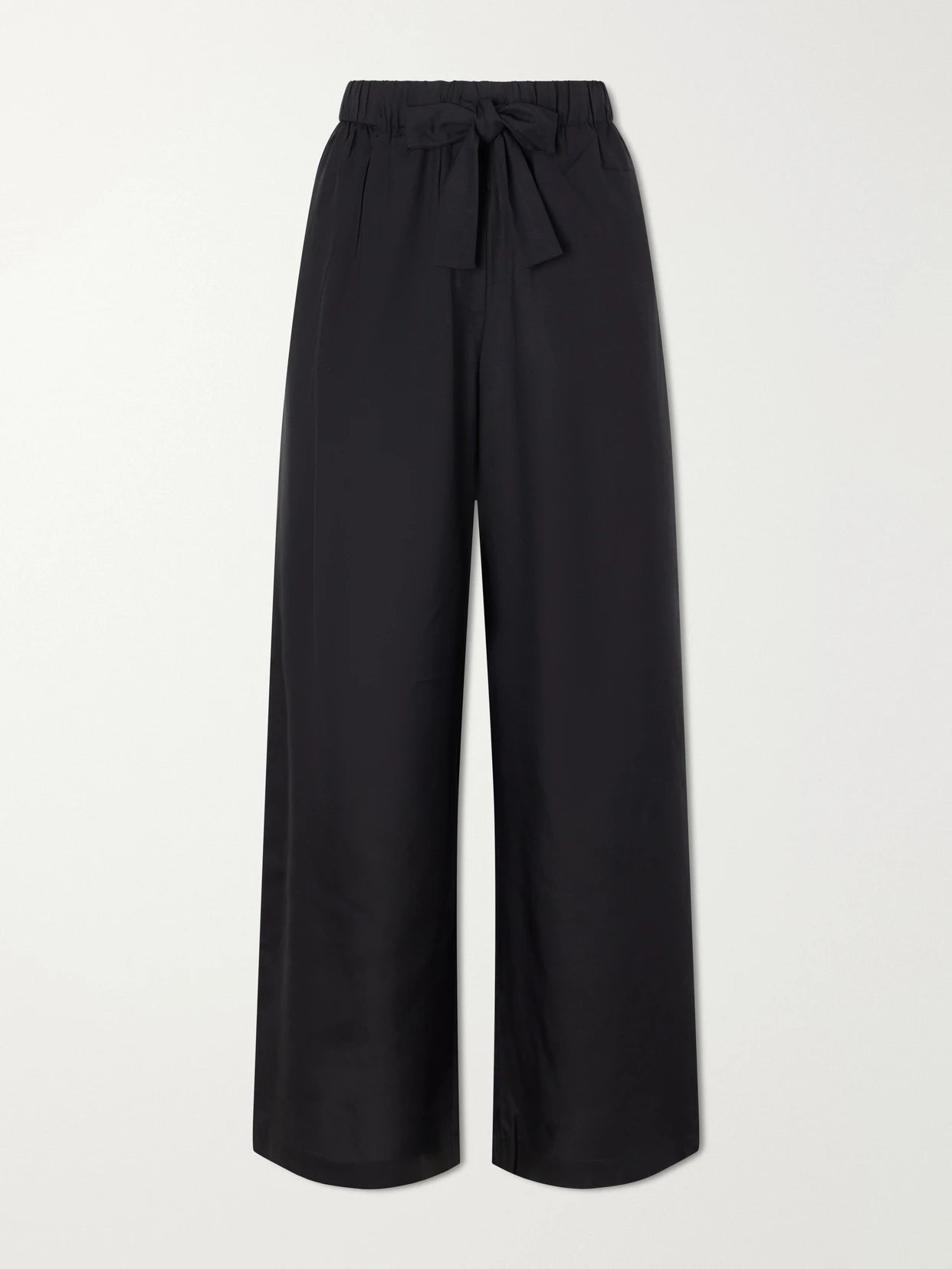 Image of a model wearing Pants. Product name - Silk Wide-leg Pants in Black colour by brand - TOTEME
