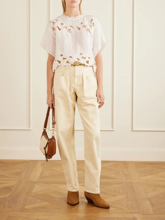 Image of a model wearing Tops. Product name - Relda Cut-out Ramie Blouse in White colour by brand - ISABEL MARANT