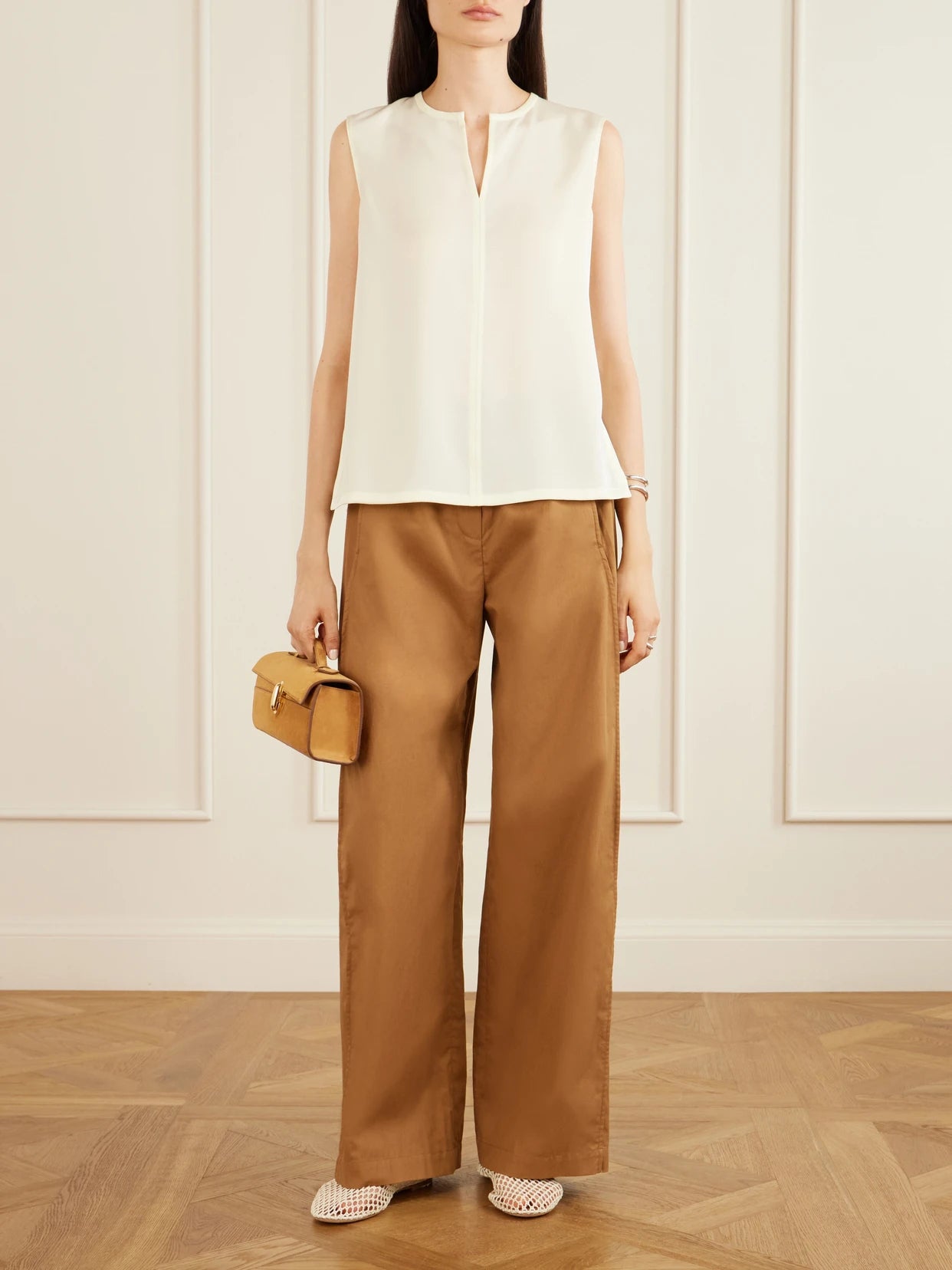 Image of a model wearing Pants. Product name - Cotton-poplin Wide-leg Pants in Bronze colour by brand - Theory