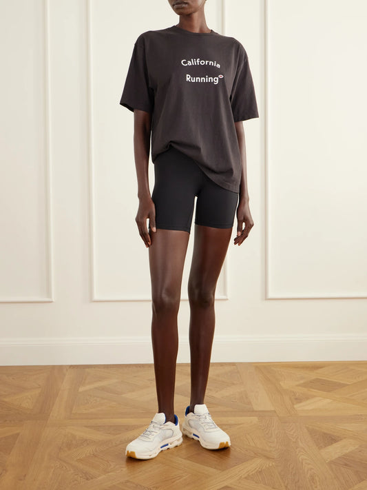 Image of a model wearing Tops. Product name - California Printed Cotton-jersey T-shirt in Black colour by brand - District Vision
