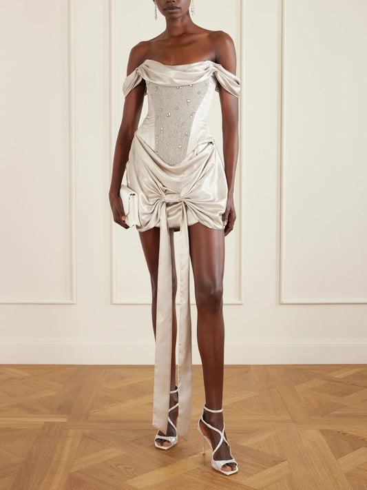 Image of Dresses. Product name - Paloma Convertible Draped Embellished Satin Mini Dress in Silver colour by brand - Clio Peppiatt
