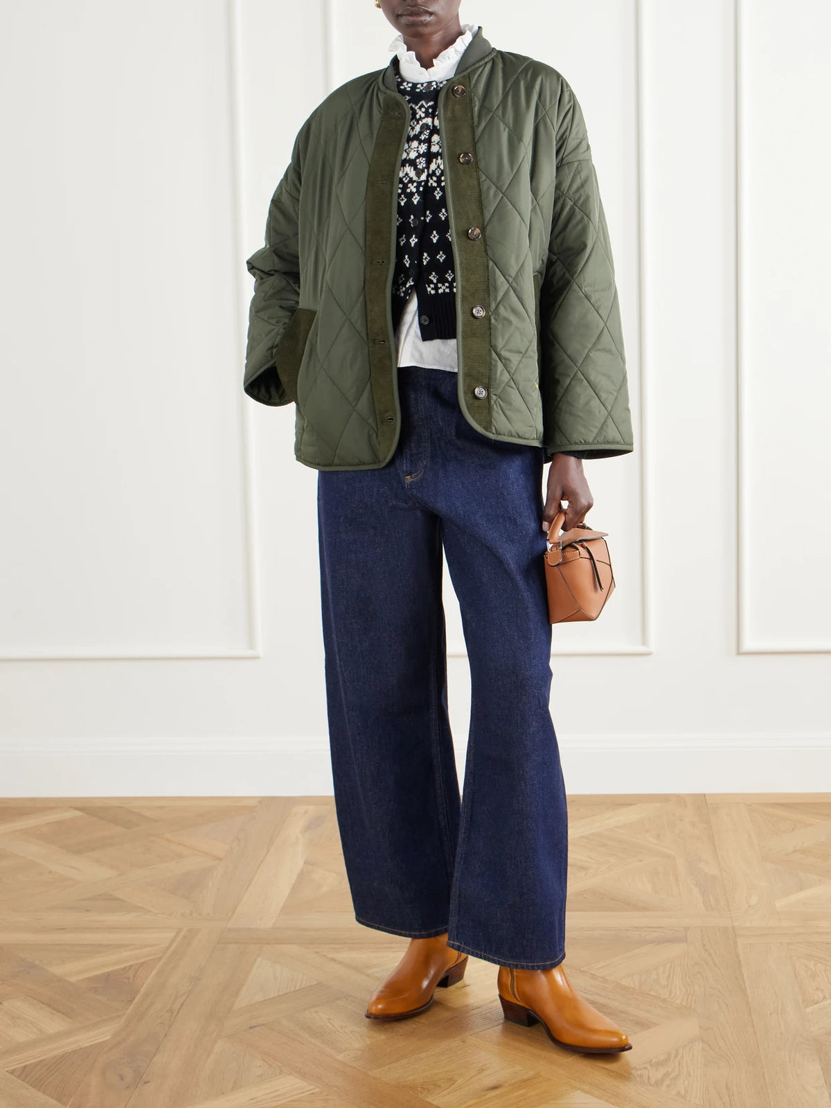 Image of a model wearing Outerwear. Product name - Cropped Fair Isle Intarsia-knit Wool, Cotton And Alpaca-blend Cardigan in Black colour by brand - Polo Ralph Lauren