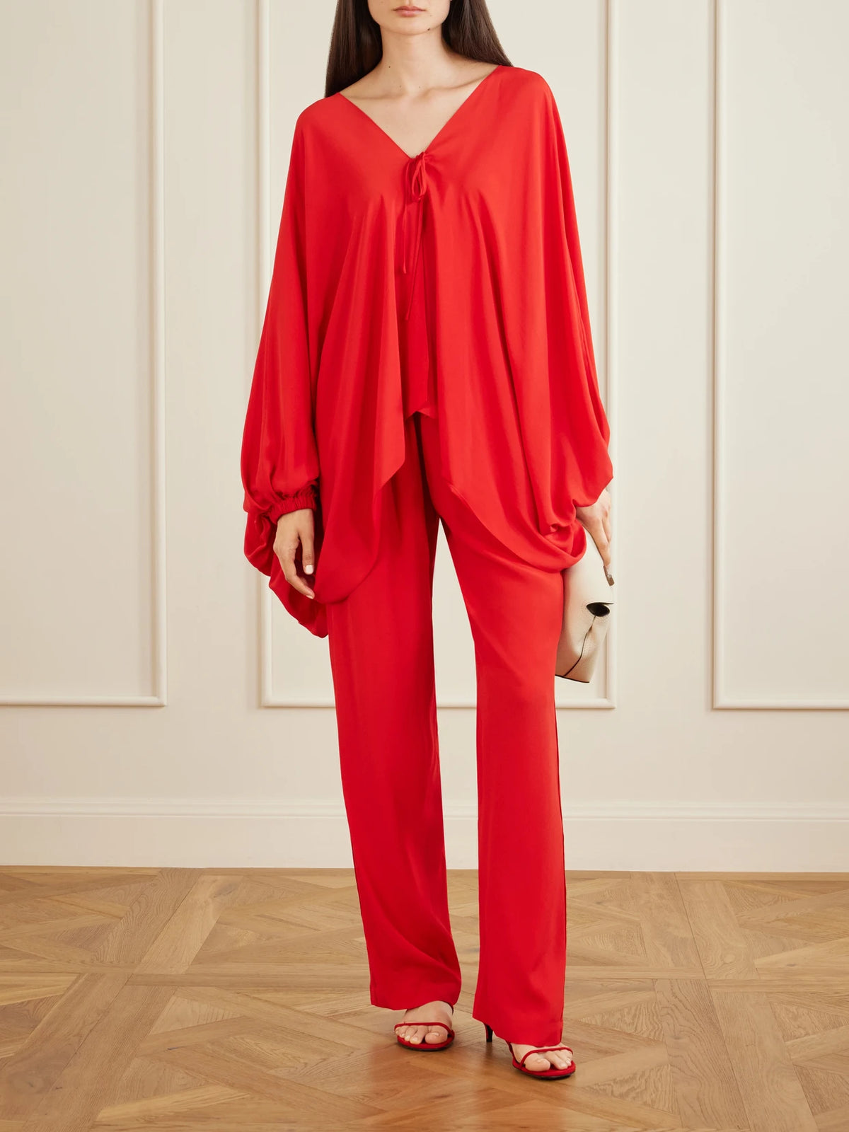 Image of a model wearing Pants. Product name - Tuileries Satin-trimmed Silk-tulle Straight-leg Pants in Red colour by brand - Sharon Wauchob