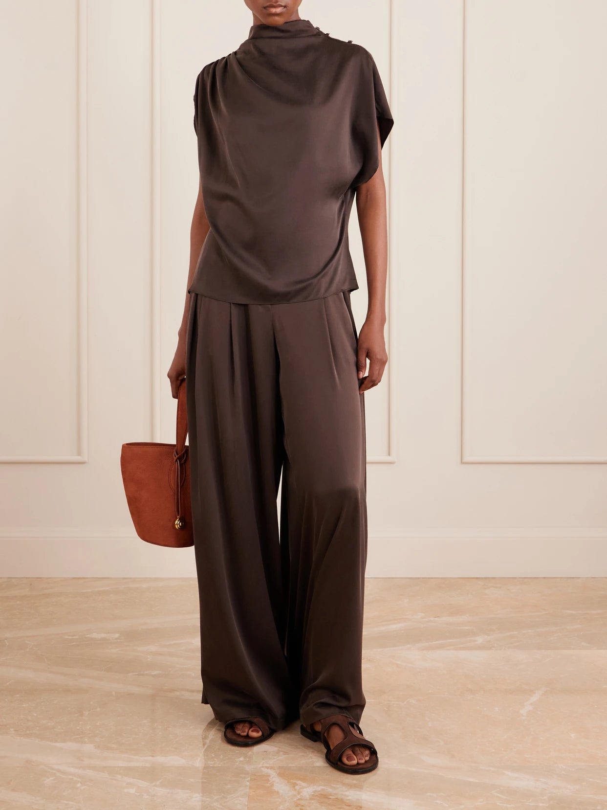 Image of a model wearing Tops. Product name - Wish You Would Draped Silk-blend Charmeuse Blouse in Brown colour by brand - TWP