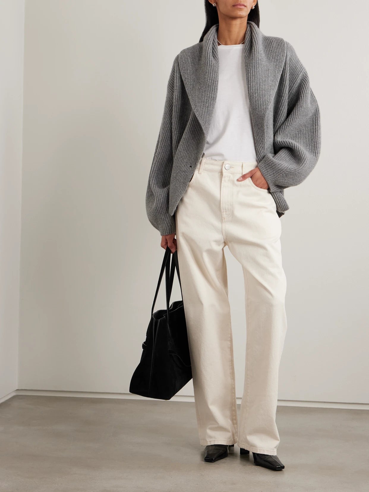 Image of a model wearing Outerwear. Product name - Oversized Ribbed Wool Cardigan in Gray colour by brand - TOTEME