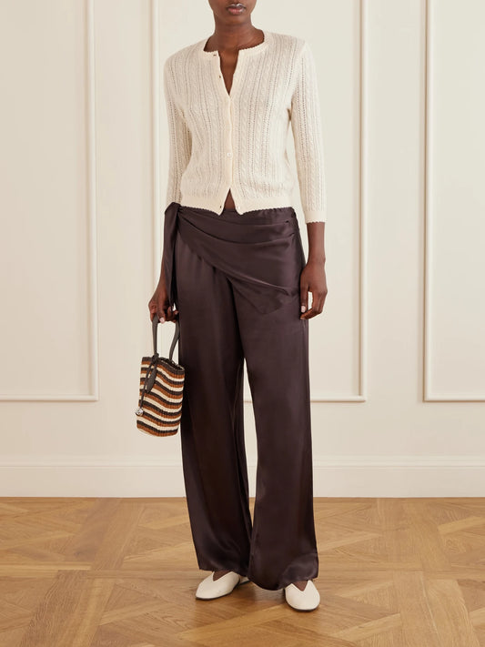 Image of a model wearing Pants. Product name - Lavona Scarf-detailed Silk Pants in Brown colour by brand - DÔEN