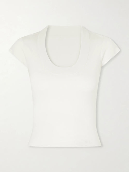 Image of a model wearing Tops. Product name - Mikkel Ribbed Wool T-shirt in Ivory colour by brand - SIR.