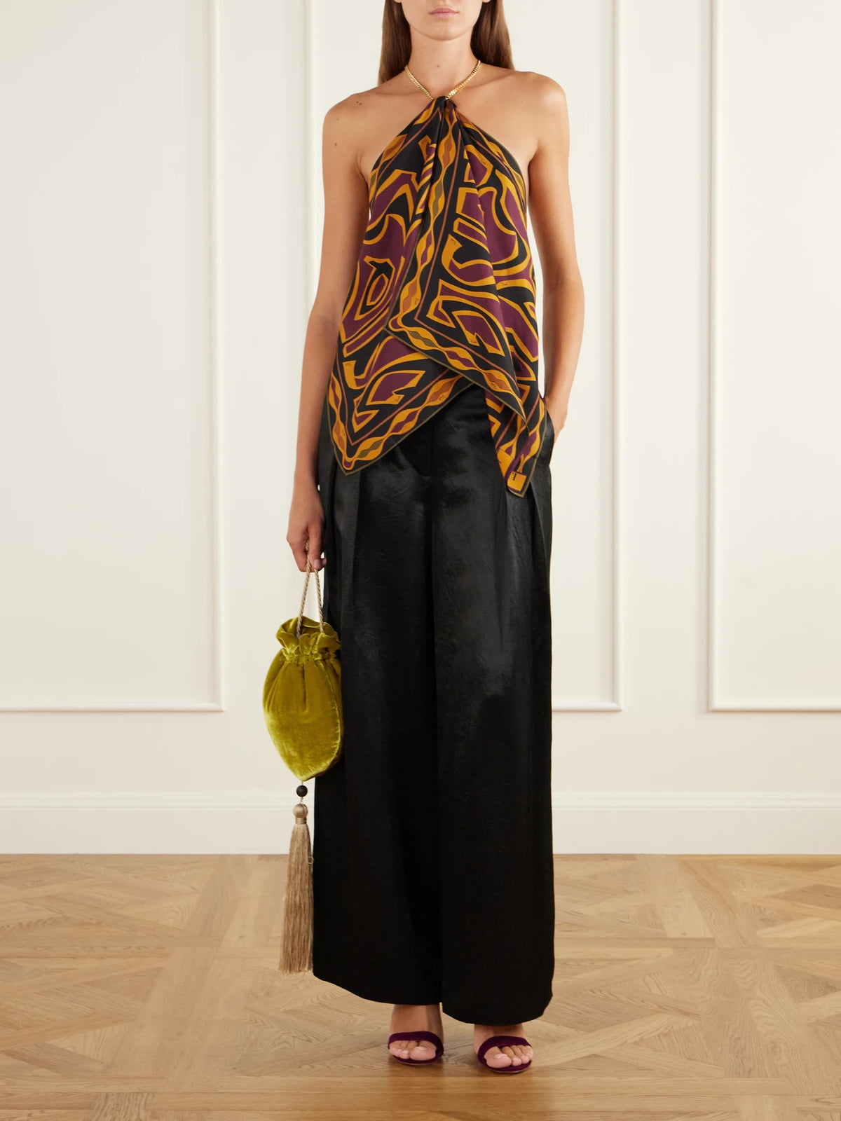 Image of a model wearing Tops. Product name - Chain-embellished Draped Printed Silk-twill Halterneck Top in Orange, Multi colour by brand - PUCCI