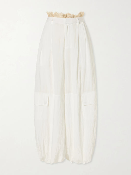 Image of a model wearing Pants. Product name - Lisette Lace-trimmed Shell Balloon Pants in White colour by brand - Sea