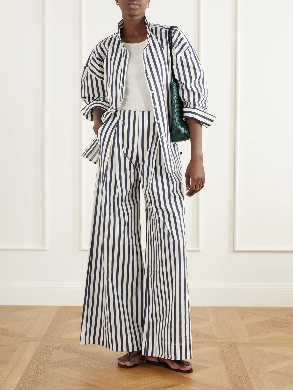 Image of a model wearing Tops. Product name - Un Tej Striped Cotton-poplin Shirt in Multi colour by brand - Andres Otalora
