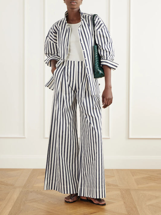 Image of a model wearing Tops. Product name - Un Tej Striped Cotton-poplin Shirt in Multi colour by brand - Andres Otalora