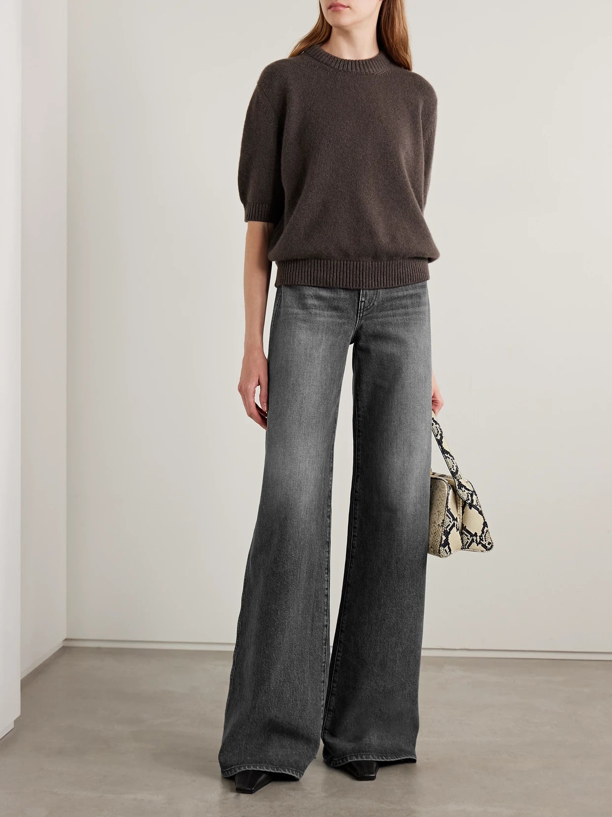 Image of a model wearing Outerwear. Product name - Davin Cashmere Sweater in Brown colour by brand - KHAITE