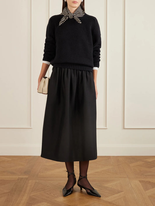 Image of a model wearing Skirts. Product name - Gathered Wool And Silk-blend Midi Skirt in Black colour by brand - TOTEME