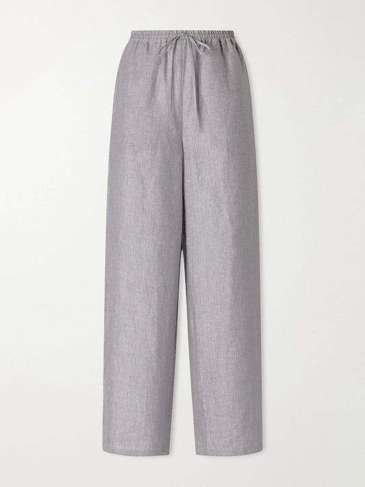 Image of a model wearing Pants. Product name - Bienheureux Linen Straight-leg Drawstring Pants in Gray colour by brand - Eres