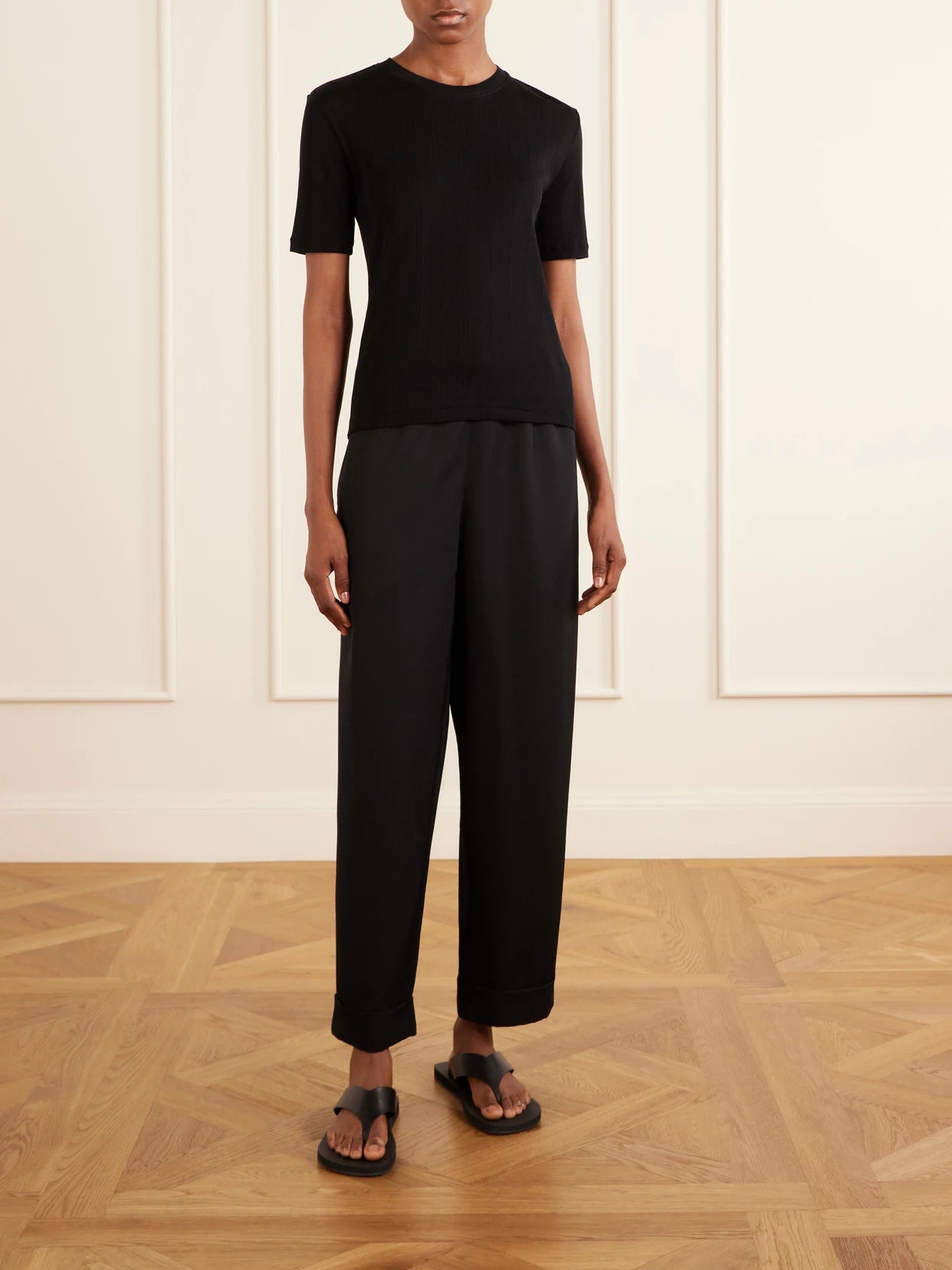 Image of a model wearing Tops. Product name - Etina Cotton-jersey T-shirt in Black colour by brand - The Row