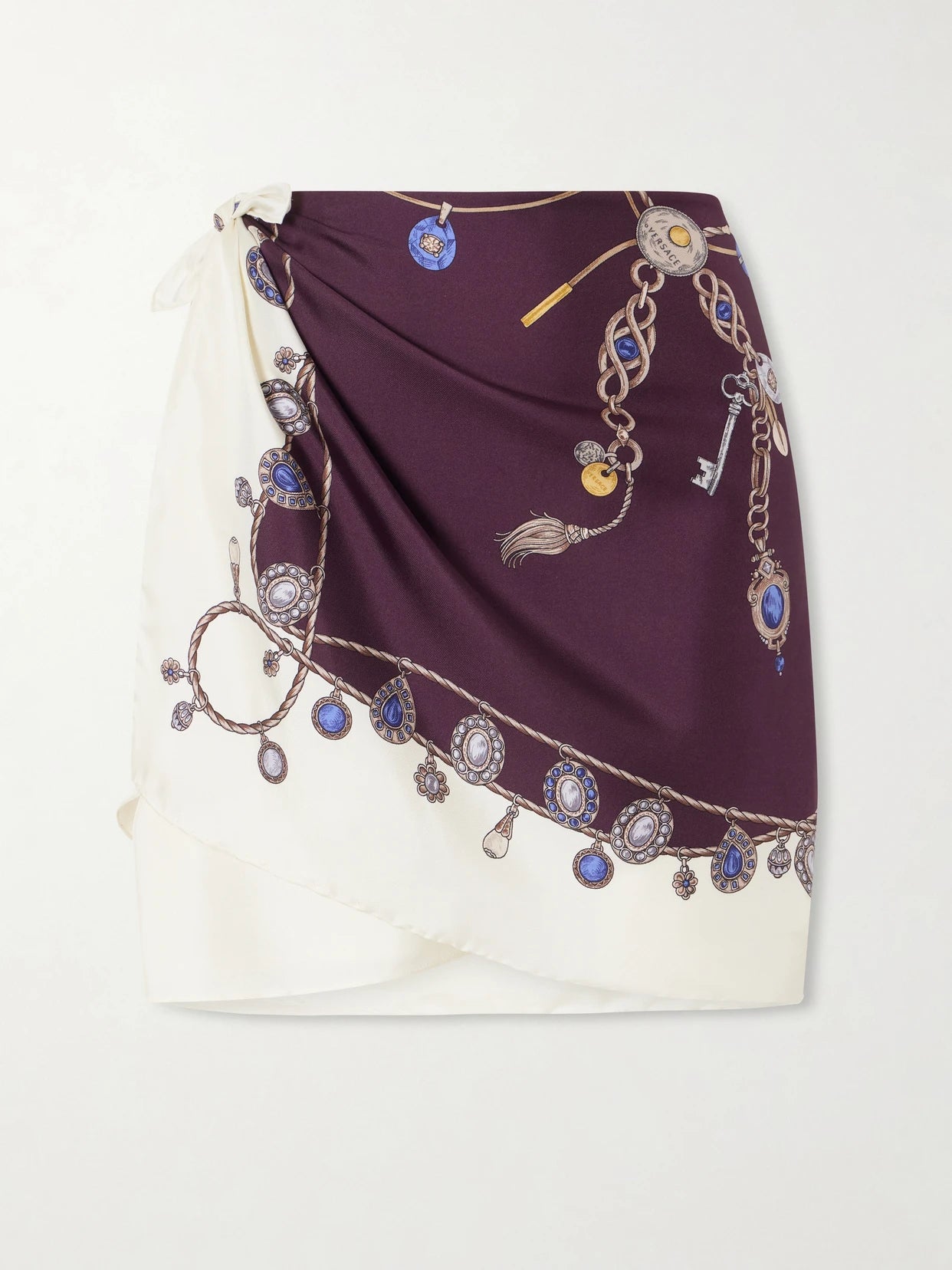 Image of a model wearing Skirts. Product name - Printed Silk-twill Mini Wrap Skirt in Brown colour by brand - Versace