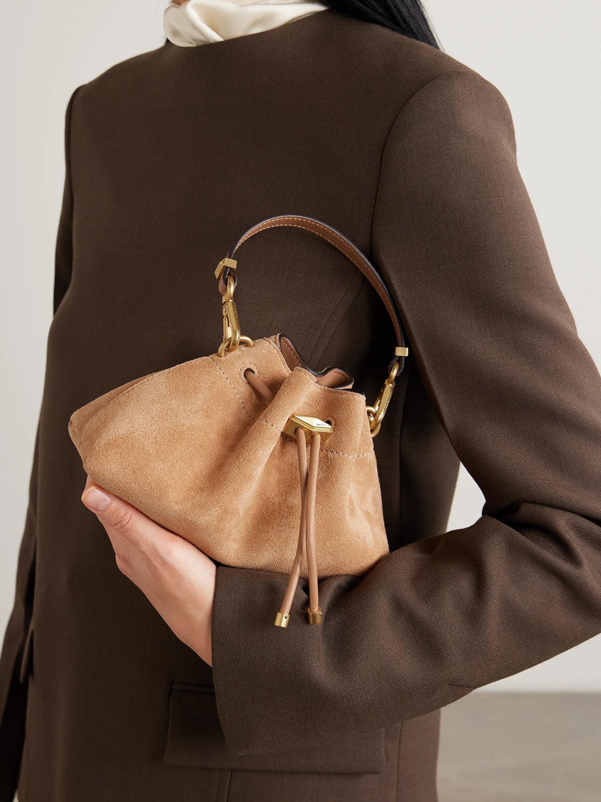Image of Bags. Product name - Cinch Small Leather-trimmed Suede Shoulder Bag in Camel colour by brand - Jimmy Choo