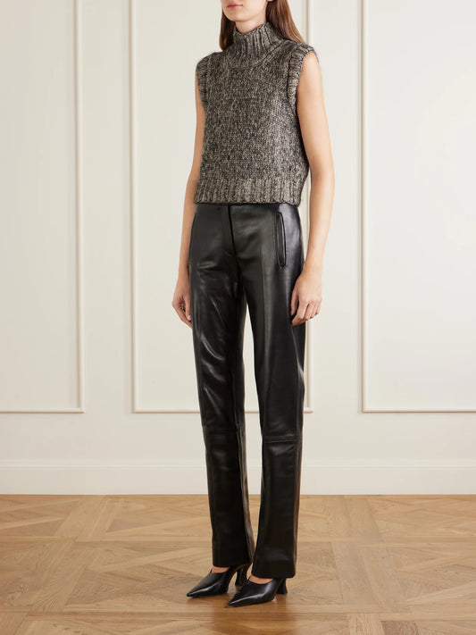 Image of a model wearing Outerwear. Product name - Fawn Cashmere, Mohair And Silk-blend Mélange Turtleneck Sweater Vest in Black colour by brand - KHAITE