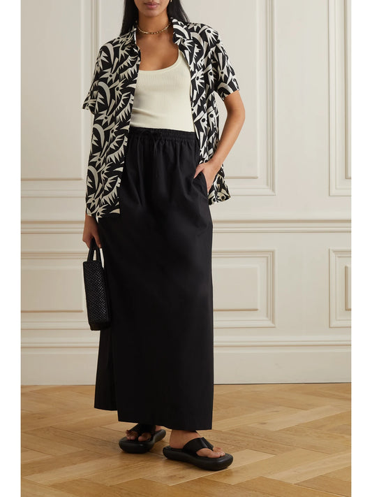 Image of a model wearing Tops. Product name - + Net Sustain Ribbed-knit Tank in Ecru colour by brand - Matteau